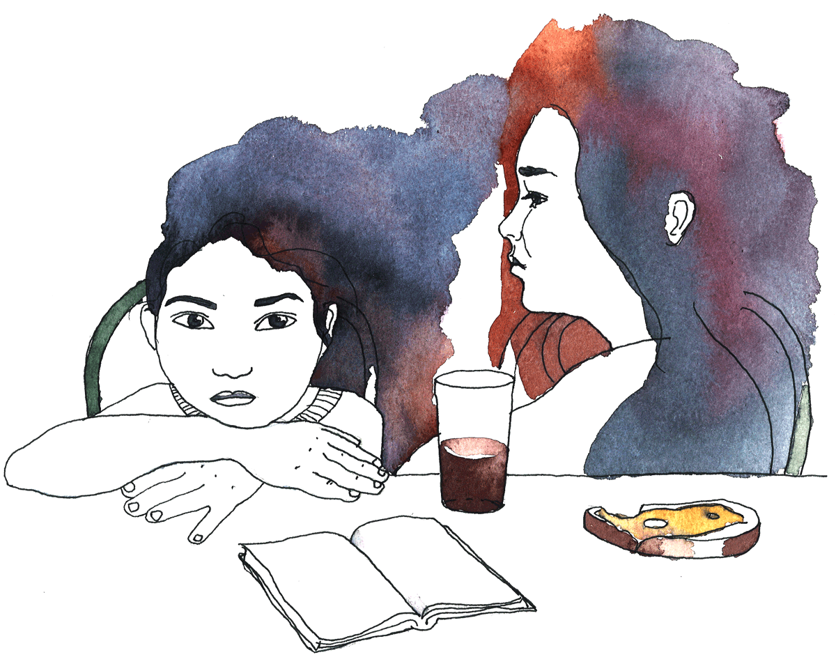 Barn som sitter vid ett bord och läser