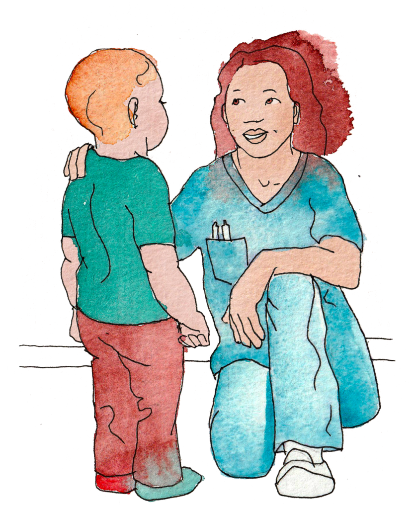 En vårdanställd som håller om ett barn.