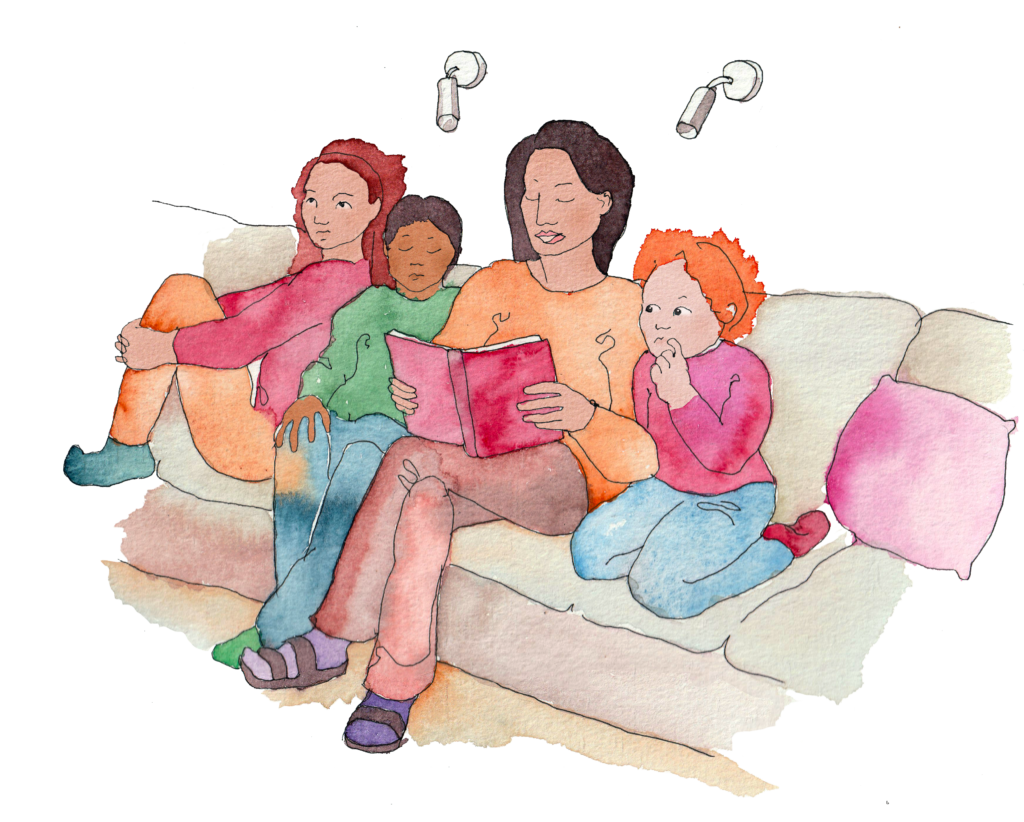 En vuxen som läser en bok för tre barn.